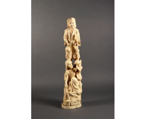 A Japanese carved ivory figure of a woodsman and his wife, Meiji period (1868-1912), he holding an axe and a gourd water bott