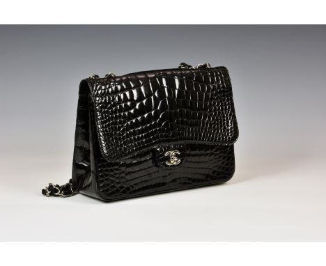 Chanel - a black alligator Jumbo flap bag, c. 2010, with single outside pocket, silver hardware and black lambskin lined inte