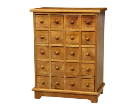 A 20th century teak twenty drawer chest, the moulded top over five banks of four drawers, all with turned wooden handles, rai