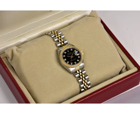 A Rolex Oyster Perpetual Datejust gold and stainless steel lady's bracelet watch, ref. 69173, circa 1990, serial no. L730848,