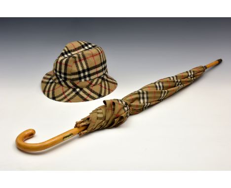 A vintage Burberry umbrella, with wooden crook handle; together with a vintage Burberry Fedora style woollen hat, size L. (2)
