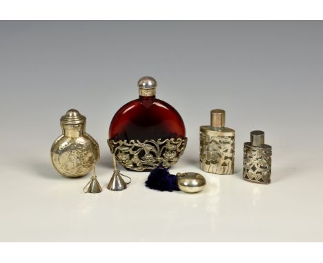 An Edwardian silver scent bottle case, M. Bros, Birm. 1901, the hinged two-part body of flask form with hinged cover and repo