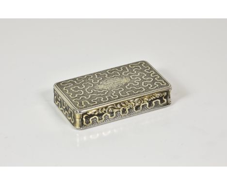 A French silver gilt snuff box, indistinct marks, rectangular form with rounded corners, ornate wrigglework decoration throug