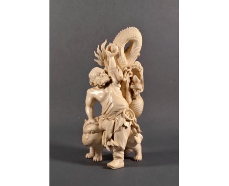 A Japanese carved ivory okimono of a rakan, Meiji period (1868-1912), with his right hand and one knee resting on the back of