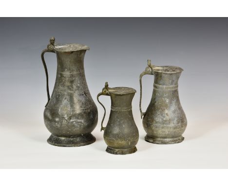 A matched graduated set of three 18th century Guernsey pewter measures, comprising a pot size measure, initials 'PDN R' to li
