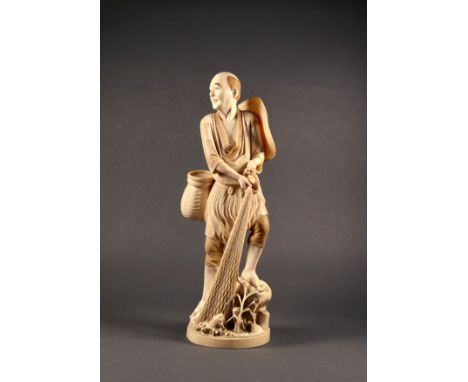 A finely carved Japanese ivory figure of a fisherman, pulling up his fishing net, a hat on one shoulder and a basket on his h