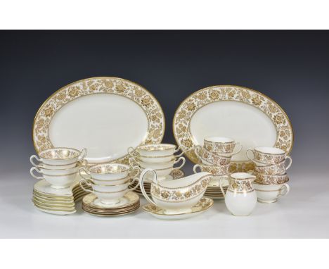 A Wedgwood Gold Damask pattern part dinner service, comprising two graduated 15in. and 13in. oval platters; six two handled s