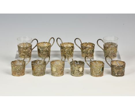 A set of six silver Chinese export Wang Hing tea glass holders, of pierced bamboo design, with high loop handle, vacant shiel