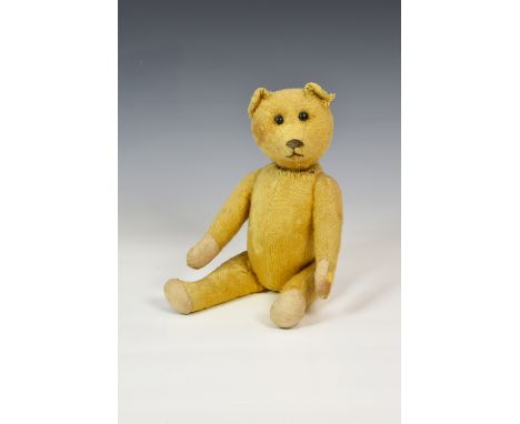 A well loved 1920s German Schuco (Schreyer & Co) 14in. Yes/No Teddy Bear, straw filled, with golden short mohair, pronounced 