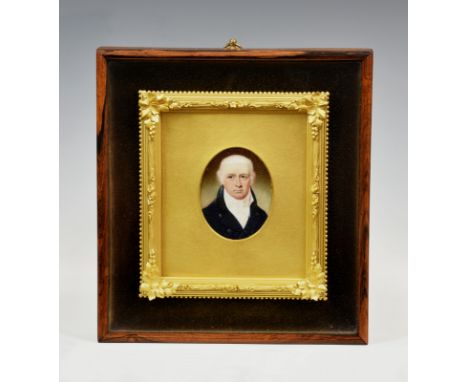 A 19th century English School portrait miniature of a gentleman, oval watercolour on ivory, his hair powdered, in a dark blue