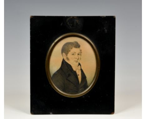 A Regency watercolour portrait miniature of a gentleman, c.1815, oval watercolour on paper, in a black coat and waistcoat and