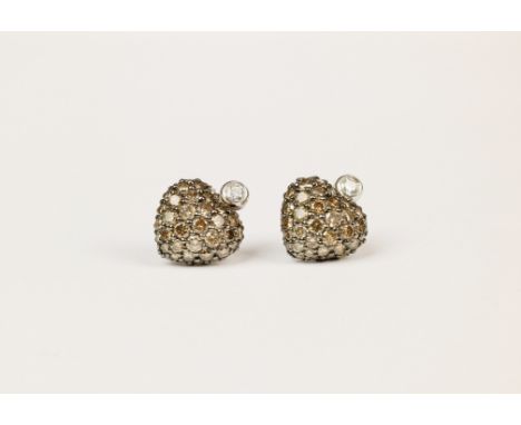 A pair of fancy brown diamond heart earrings by Chopard, the hearts studded with fancy brown, pavé cut diamonds and with beze