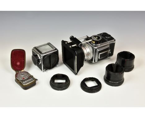 A Hasselblad 500 C medium format camera body with Carl Zeiss planar 1:2.8 F+80mm lens no. 4860191, together with another Hass