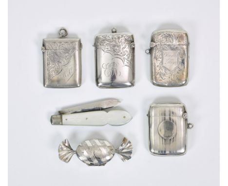 A collection of four silver vesta cases, of varying forms, dates and makers, three inscribed with initials; together with a M