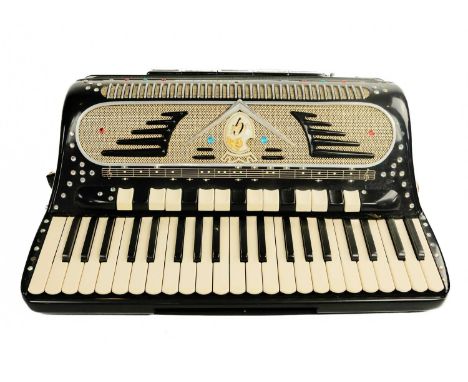 A Galanti 'Super Dominator' piano accordion, circa 1960. A one hundred and twenty bass model with forty-two keys. Manufacture