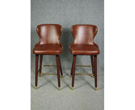 A pair of leather upholstered vintage style high stools. H.102cm. (each). 