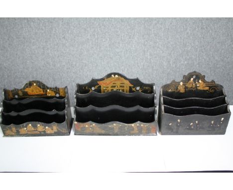 Three vintage lacquered Chinoiserie stationery racks. H.16 W.24 D.10cm. (largest). 