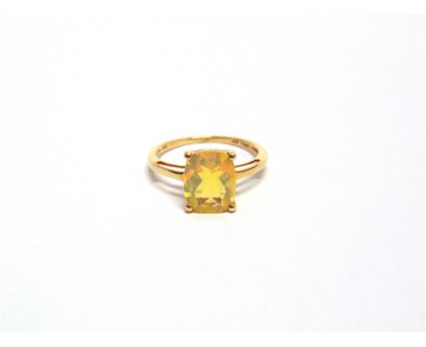 A 9 CARAT GOLD SINGLE STONE FACETTED OPAL RING finger size O, 2g gross