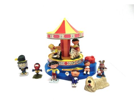 A CORGI NO.H852, MAGIC ROUNDABOUT CAROUSEL  red, yellow and blue, with a clockwork musical movement, complete with seated fig