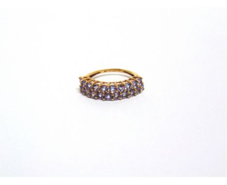 A 9 CARAT GOLD TWENTY STONE TANZANITE HALF HOOP RING the round cuts set in two rows, finger size K, 2.3g gross