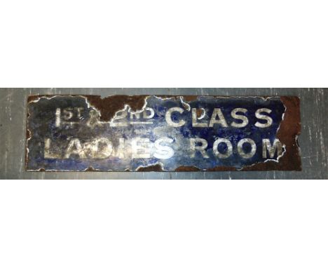 AN ENAMEL SIGN '1ST & 2ND CLASS / LADIES ROOM'  with white lettering against a dark blue ground, 25.5cm x 91.5cm.