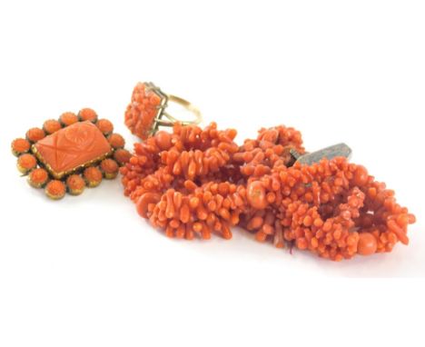 A group of coral jewellery, to include a rectangular carved coral panel dress ring, on a raised basket, yellow metal stamped 