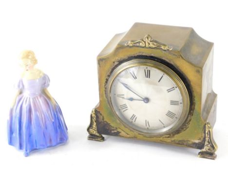 A 20thC gilt metal mantel clock, the 8cm diameter Roman numeric dial stamped Swiss Made, with plain pointers, in shaped case 
