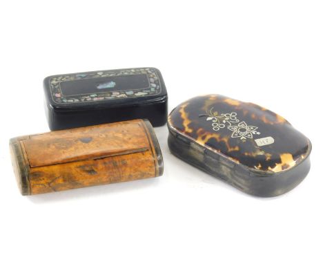 A 19thC tortoise shell snuff box, of oval form, decorated with flowers with an initialled cartouche, 8cm wide, a papier mache
