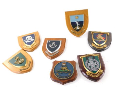 Various oak and other backed military wall plaques, to include Royal Artillery with shield back, display troop with crest, 19