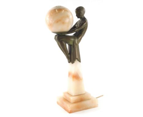 A 20thC Art Deco table lamp, formed as a dancing girl seated holding glass orb, on marble finish stepped obelisk base, 46cm h