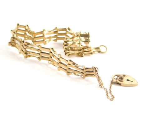 A 9ct gold gate bracelet, of three bar design with safety chain and love heart small padlock, 17cm long, 4.6g.