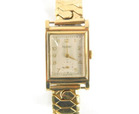A Rotary 9ct gold cased gentlemans wristwatch, with a rectangular watch head on a silvered dial with seconds dial, 2cm x 2.5c
