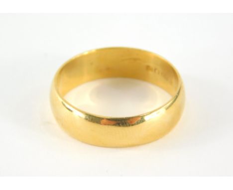 A 22ct gold wedding band, ring size R ½, 6.4g.