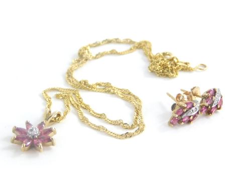 A 9ct gold ruby and diamond necklace and earring set, set with rubies and diamonds, the floral cluster pendant with central b