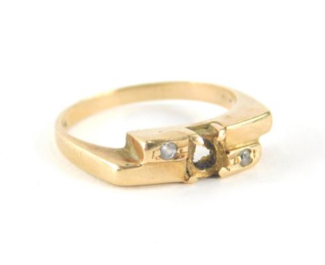 A gold dress ring, missing central stone, with two tiny diamonds, yellow metal stamped 14k, ring size K½, 3g all in. (AF)