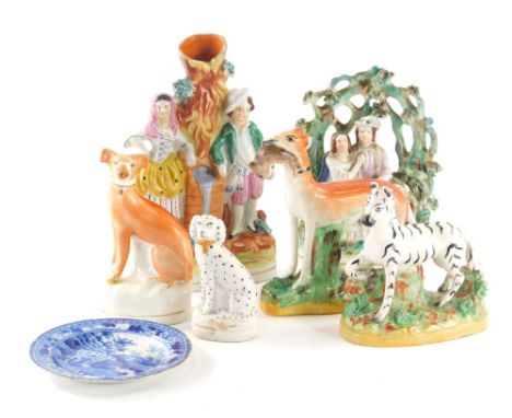 Various Staffordshire figures, etc., a standing greyhound with hare to the mouth, 15cm high, standing Dalmation figure, zebra