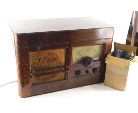 A 20thC walnut cased Ekco All electric radio TRG502 radiogram, 200-250 volts with E K Cole label, 38cm high, 59cm wide, 36cm 