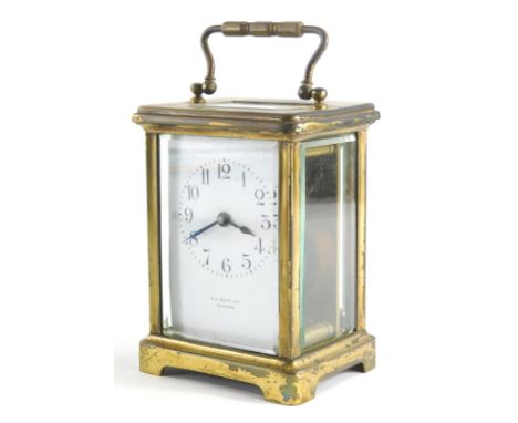 An early 20thC brass carriage clock, the back plate signed E G Routley Croydon, with Arabic dial, in a five part glazed case,