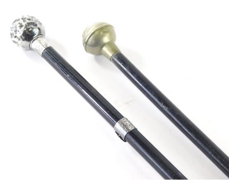 An early 20thC silver topped swagger stick, with silver collar tip and ebonised stem, 68cm high, and a further chrome topped 