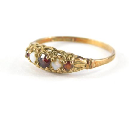 A 9ct gold opal and garnet dress ring, the textures shank size , 1.5g.