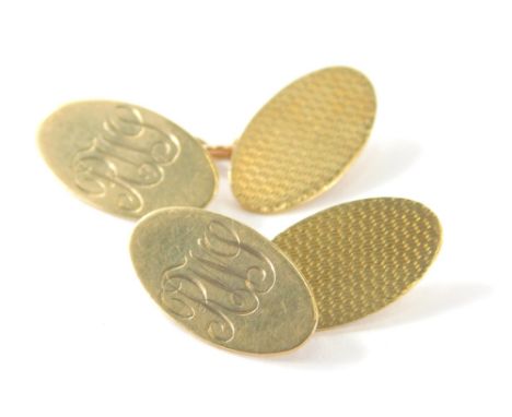 A pair of cuff links, of engine turned design, partially initialled with chained centres, marked 9ct gold, 2cm high, 4.8g. (2