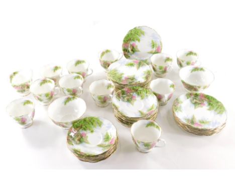 A  Royal Albert Old Mill pattern part tea service, comprising twelve cups, 7cm high, various saucers, side plates, and two su