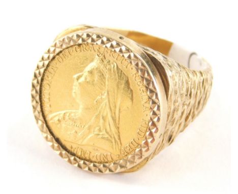 A Victoria full gold sovereign ring, the sovereign mounted in pendant surround and applied to a bark effect 9ct gold ring mou