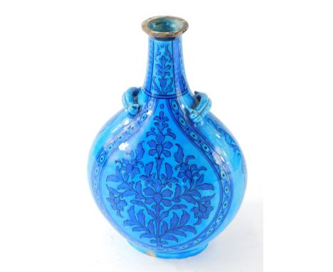 An Iznik style turquoise pottery flask, of teardrop form with moulded handles decorated with flowers in blue and turquoise on