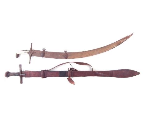 Sudanese Kaskara sword, with cross guard and leather scabbard (stuck in scabbard) also a Persian sword with remnants of gildi