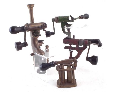 Four shotgun reloading tools, one simply marked 20, another decapper/ capper marked 12, another marked J. D&amp;S 20, another