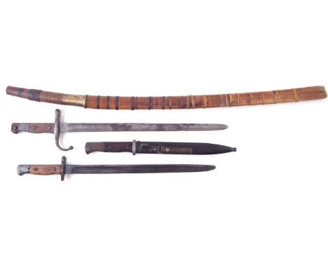 Burmese Dha/Dao sword, together with a Turkish 1887 bayonet, a 1907 pattern SMLE bayonet by Mole and a K98 bayonet and scabba