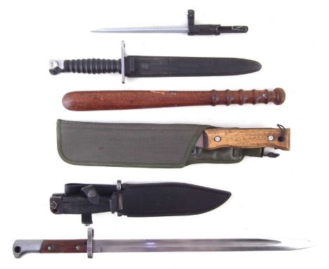 Four bayonets, to include a Swiss M.1957 bayonet and scabbard, Chinese SKS spike bayonet, unmarked Mauser rifle bayonet, AK47