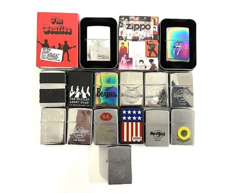 A collection of Zippo lighters, mostly sport and music related. To include: - A boxed Beatles - A boxed Elvis Presley - A box