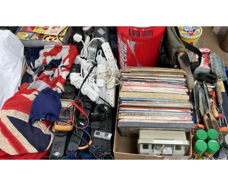A Coca Cola fridge together with flags, tools, vinyl records etc 